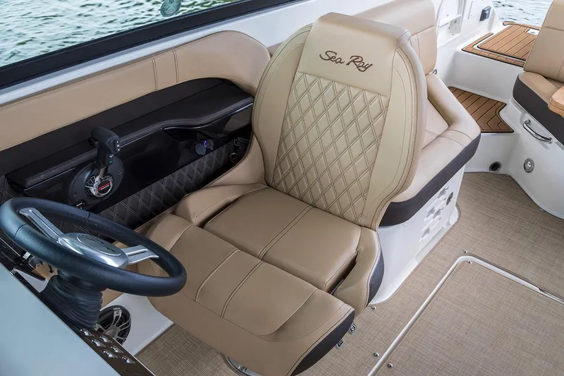 Slide: The Image of 2020 Sea Ray SLX 250 boat with tan seating and cup holders on deck. - 9