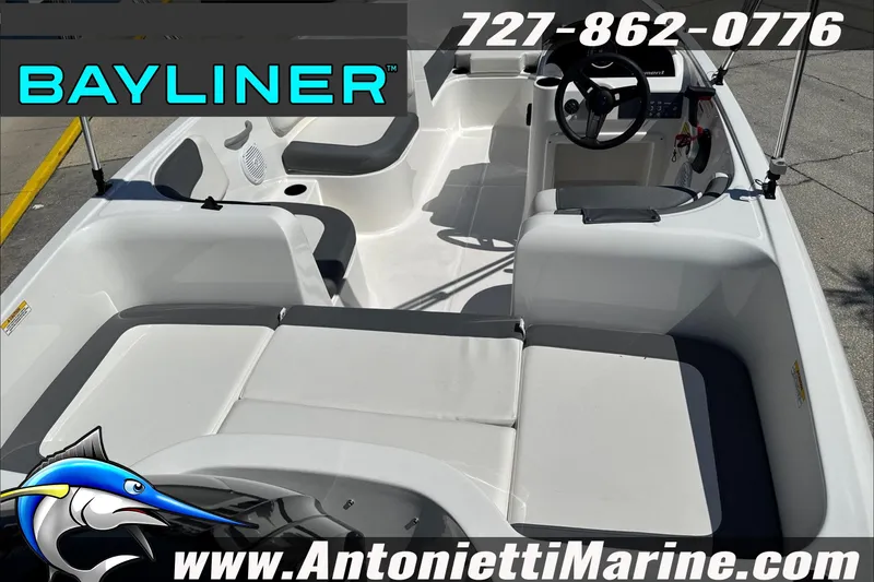 Slide: The Image of 2026 Bayliner Element E16 boat interior with seating and steering wheel, Antonietti Marine branding. - 13