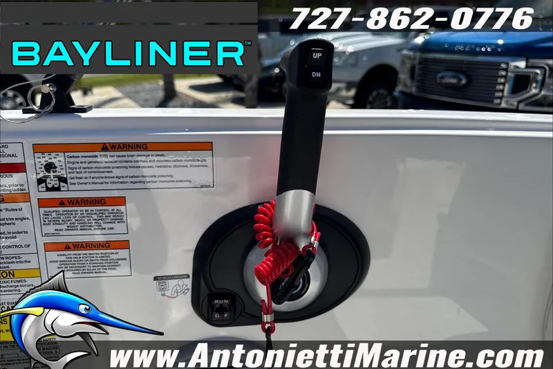 Slide: The Image of Bayliner Element E16 boat control panel with warning labels and contact information. - 18