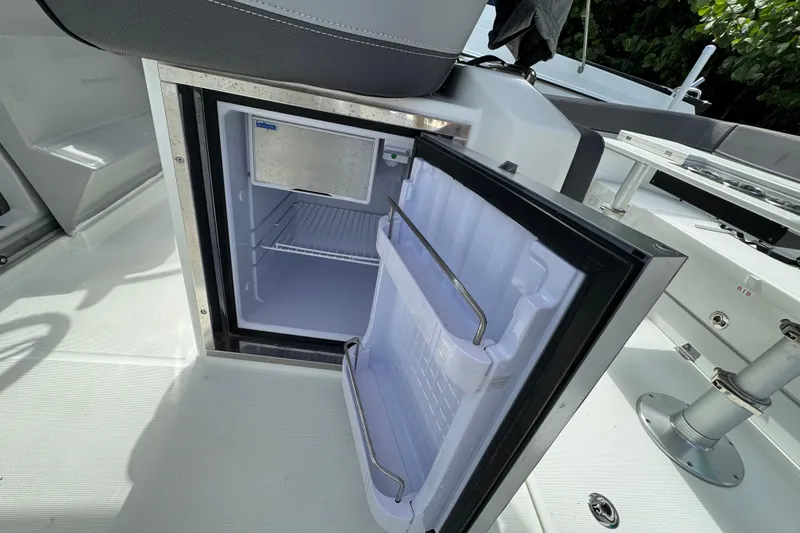 Slide: The Image of Open refrigerator on 2021 Jeanneau Leader 9.0 WA boat deck. - 10