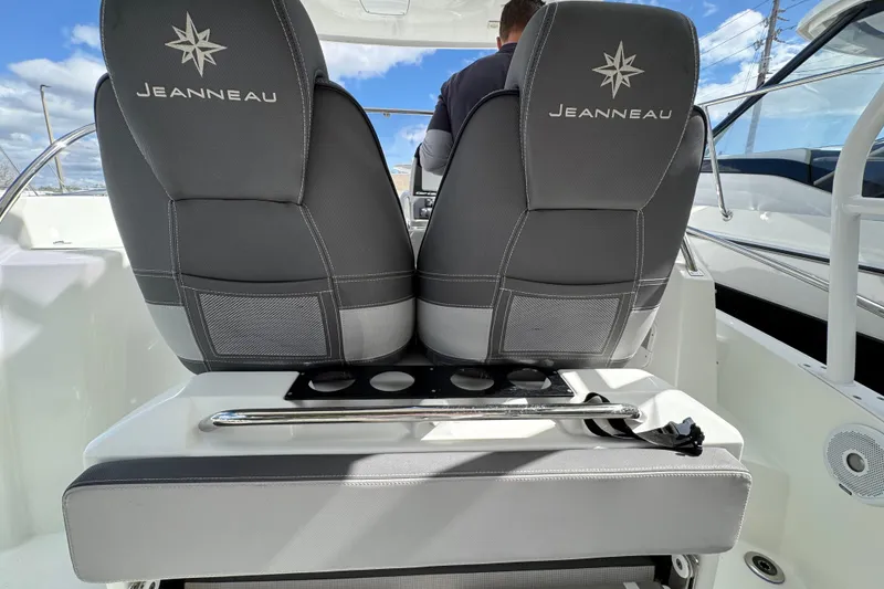 Slide: The Image of 2021 Jeanneau Leader 9.0 WA boat seats with logo, featuring sleek design and cup holders. - 12