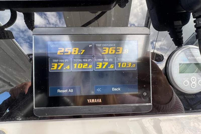 Slide: The Image of Yamaha display showing fuel usage and trip data on Jeanneau Leader 9.0 WA, 2021 model. - 15