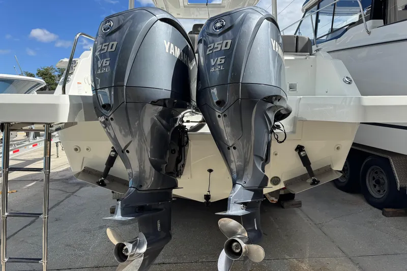 Slide: The Image of 2021 Jeanneau Leader 9.0 WA with twin Yamaha 250 V6 outboard engines. - 2