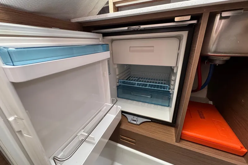 Slide: The Image of Compact fridge in 2021 Jeanneau Leader 9.0 WA boat interior. - 20