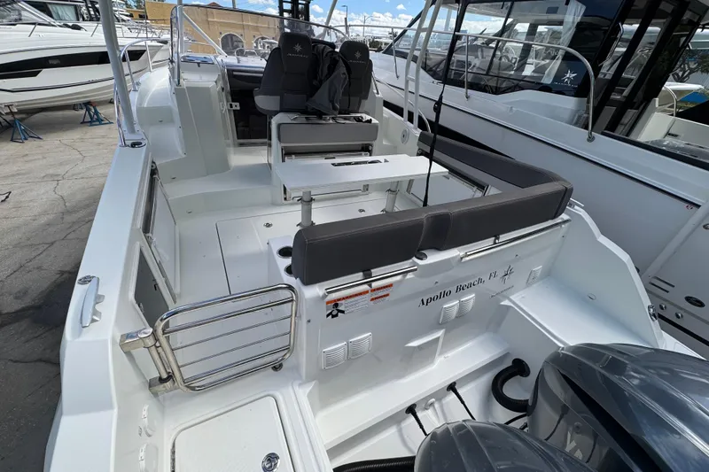 Slide: The Image of 2021 Jeanneau Leader 9.0 WA boat interior with seating and controls. - 3