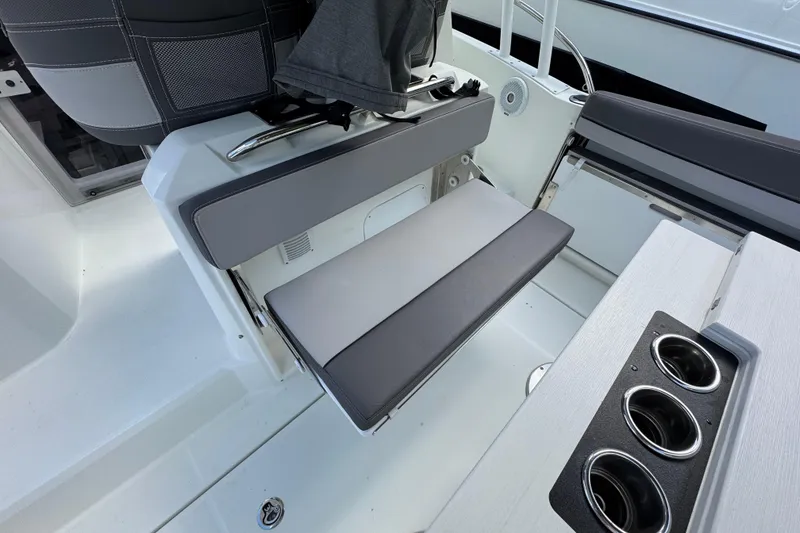 Slide: The Image of 2021 Jeanneau Leader 9.0 WA boat interior with gray seating and cup holders. - 7