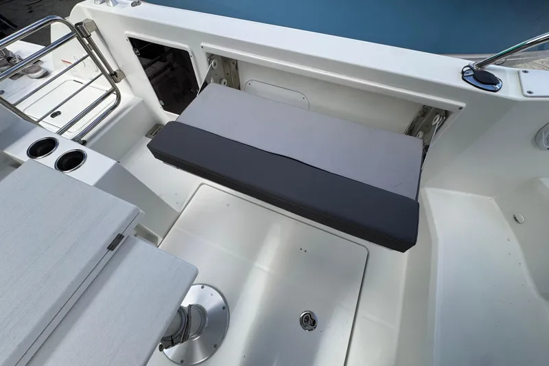 Slide: The Image of 2021 Jeanneau Leader 9.0 WA boat interior with seating and cup holders. - 8