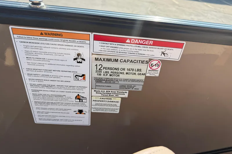 Slide: The Image of Warning and capacity labels on a 2017 South Bay 523RS-DC boat. - 18