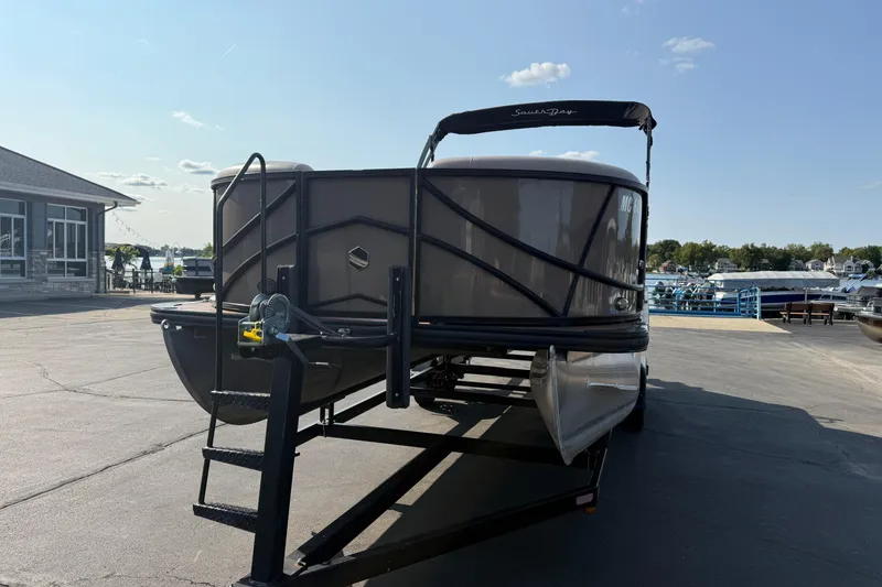 Slide: The Image of 2017 South Bay 523RS-DC pontoon boat on trailer at marina. - 2