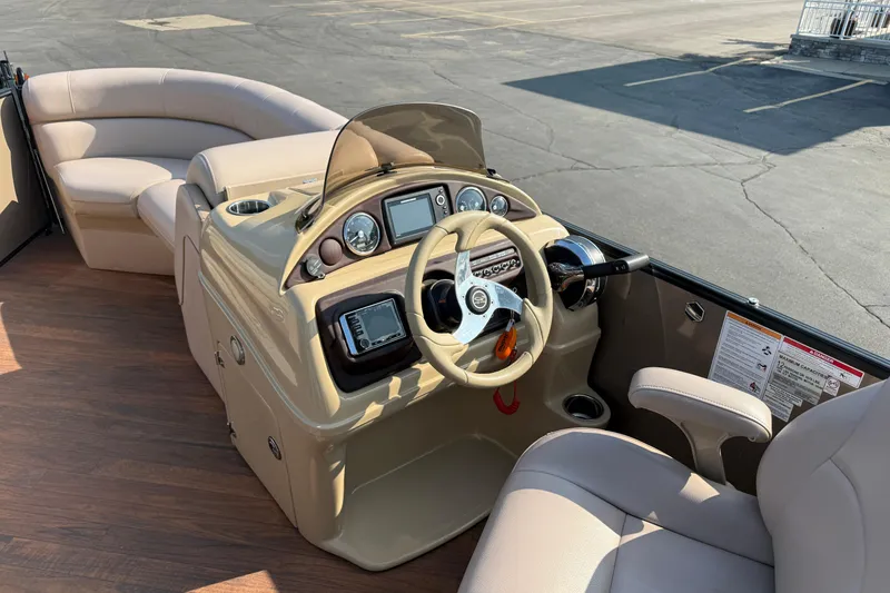 Slide: The Image of 2017 South Bay 523RS-DC boat interior with steering console and seating. - 25