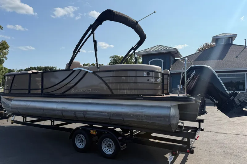 Slide: The Image of 2017 South Bay 523RS-DC pontoon boat on trailer, featuring Mercury outboard motor. - 5