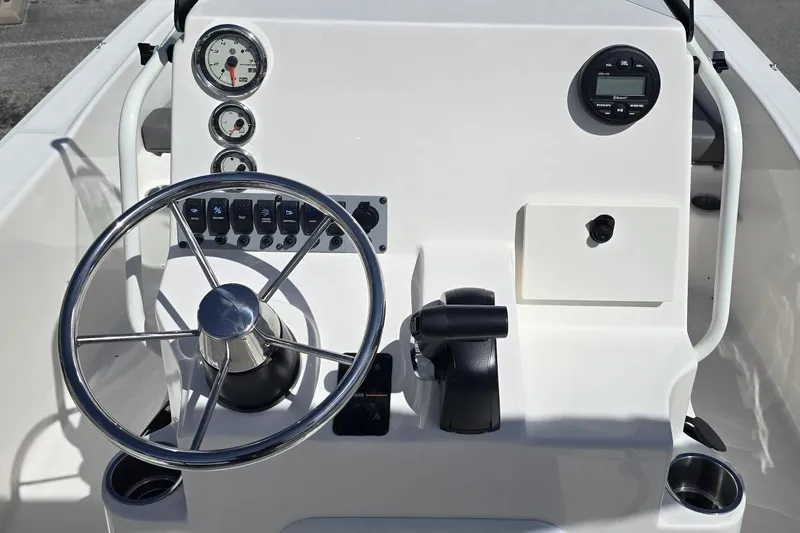 Slide: The Image of Steering console of 2026 Sundance DX20 boat with gauges and controls. - 7