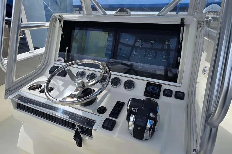 Slide: The Image of 2020 SeaVee 390Z boat dashboard with steering wheel and digital display. - 15