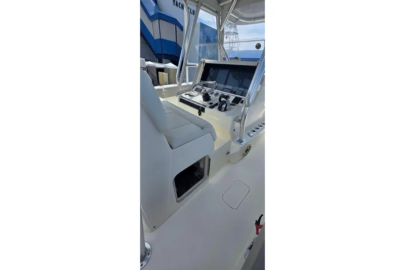 Slide: The Image of 2020 SeaVee 390Z boat helm with modern controls and seating. - 16