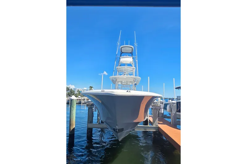 Slide: The Image of 2020 SeaVee 390Z boat docked under clear blue sky. - 2