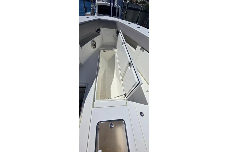 Slide: The Image of 2020 SeaVee 390Z boat with open storage compartment, showcasing sleek design. - 22