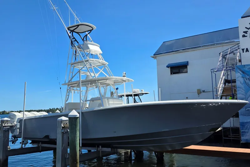 Slide: The Image of 2020 SeaVee 390Z boat docked at marina under clear blue sky. - 3