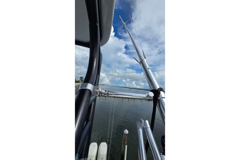 Slide: The Image of 2020 SeaVee 390Z boat with fishing rods against a cloudy sky backdrop. - 30