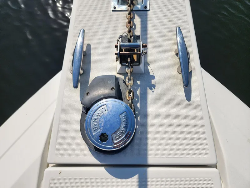 Slide: The Image of Anchor chain and winch on 2002 Formula 31 PC boat deck. - 12