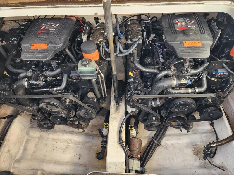 Slide: The Image of Twin engines in a 2002 Formula 31 PC boat, showcasing detailed mechanical components. - 14