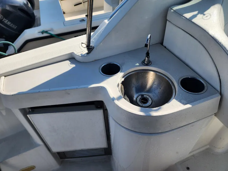 Slide: The Image of 2002 Formula 31 PC boat kitchenette with sink and storage. - 3