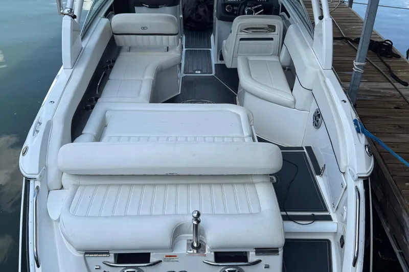 Slide: The Image of 2013 Cobalt 26SD WSS boat interior with white seating and sleek design. - 2