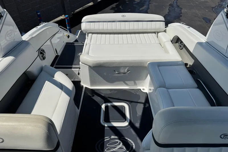 Slide: The Image of 2013 Cobalt 26SD WSS boat interior with white seating and sleek design. - 3