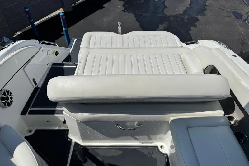 Slide: The Image of 2013 Cobalt 26SD WSS boat interior with white leather seating. - 4