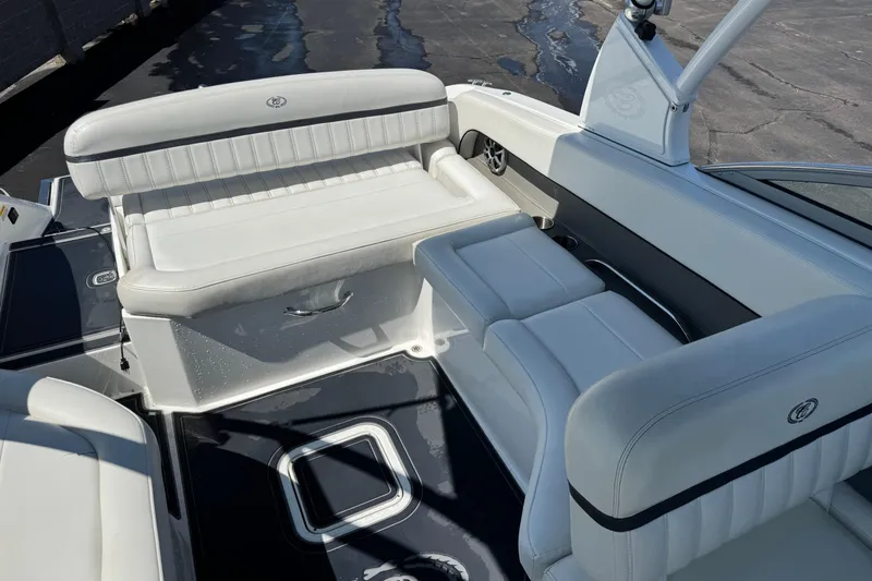 Slide: The Image of 2013 Cobalt 26SD WSS boat interior with white leather seating and sleek design. - 6