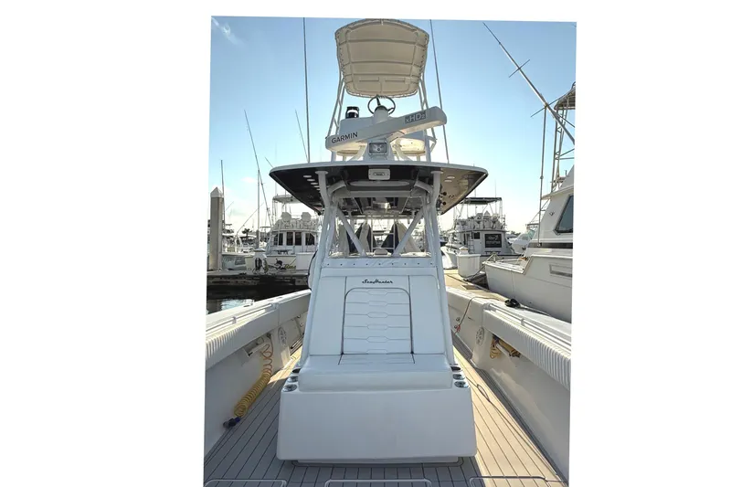 Slide: The Image of 2007 SeaHunter 40 boat docked at marina, featuring Garmin equipment. - 17