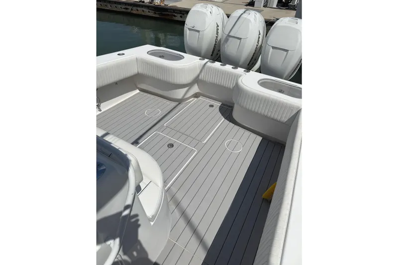 Slide: The Image of 2007 SeaHunter 40 boat deck with seating and multiple outboard engines. - 22