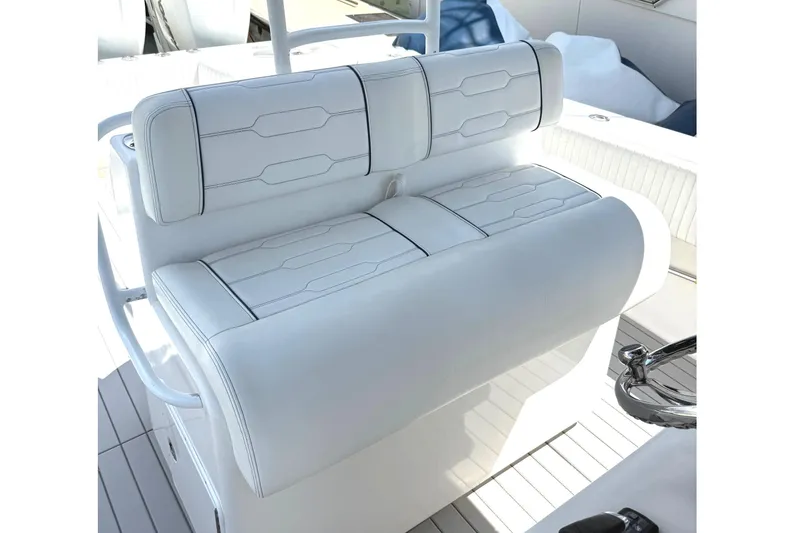 Slide: The Image of White cushioned seating on 2007 SeaHunter 40 boat, featuring sleek design and stitching. - 25