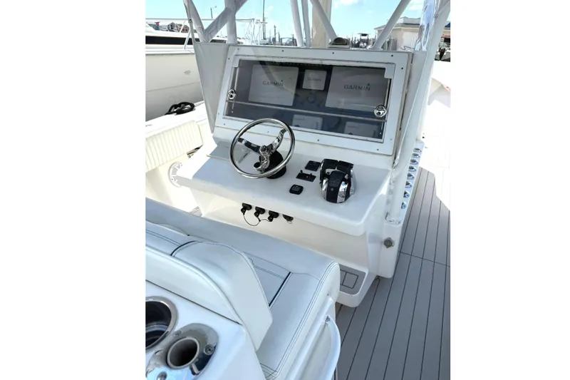 Slide: The Image of 2007 SeaHunter 40 boat helm with Garmin navigation system and steering wheel. - 26