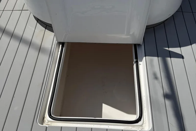 Slide: The Image of Open hatch on 2007 SeaHunter 40 boat deck, showing interior compartment. - 30