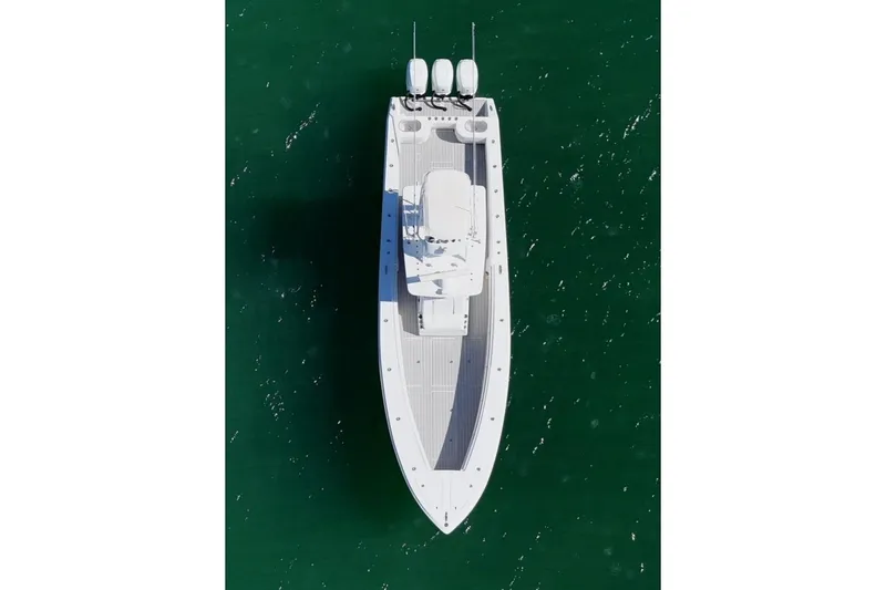 Slide: The Image of Aerial view of 2007 SeaHunter 40 boat on green water. - 4