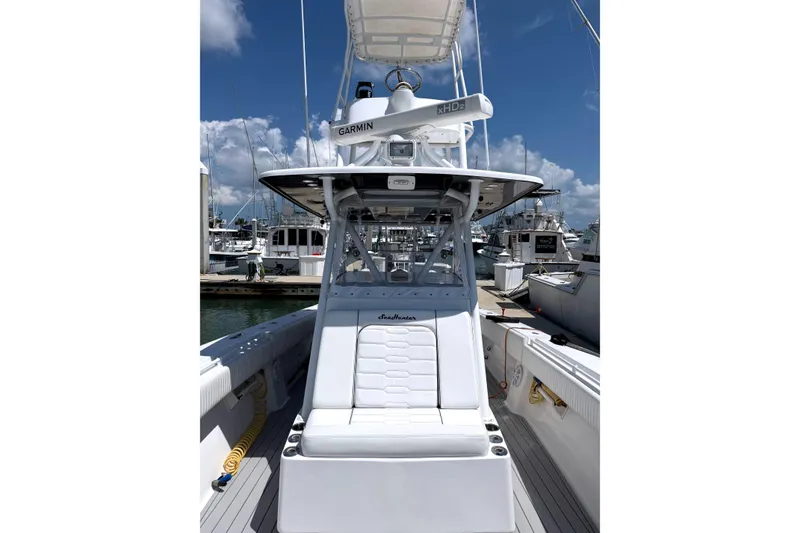 Slide: The Image of 2007 SeaHunter 40 boat with Garmin radar, docked at a marina under a clear blue sky. - 9