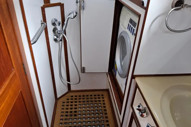 Slide: The Image of 1997 Grand Banks 46 Europa yacht bathroom with shower and washing machine. - 11