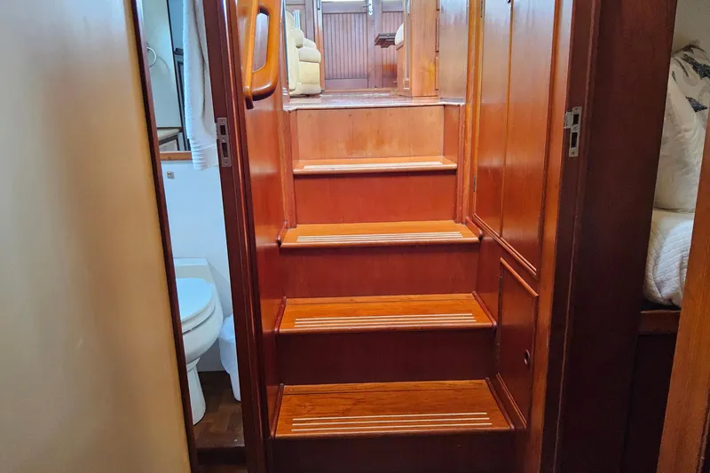 Slide: The Image of Interior stairs of 1997 Grand Banks 46 Europa yacht with wooden finish. - 15