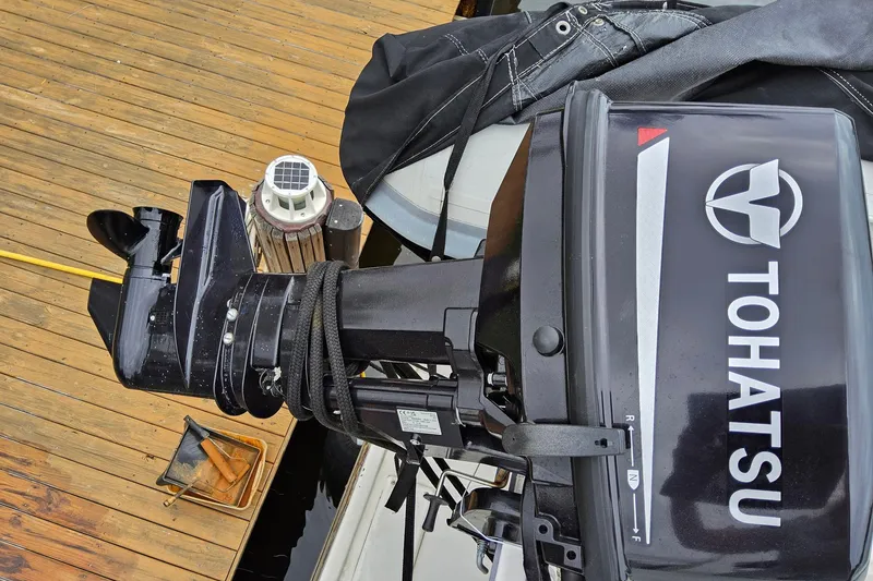 Slide: The Image of Tohatsu outboard motor on a 1997 Grand Banks 46 Europa yacht. - 26