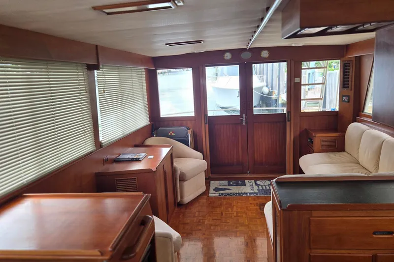 Slide: The Image of Interior of 1997 Grand Banks 46 Europa yacht with wooden furnishings and comfortable seating. - 5