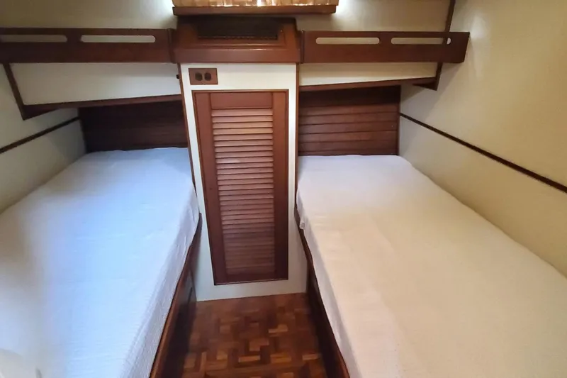 Slide: The Image of 1997 Grand Banks 46 Europa cabin with twin beds and wooden interior. - 9