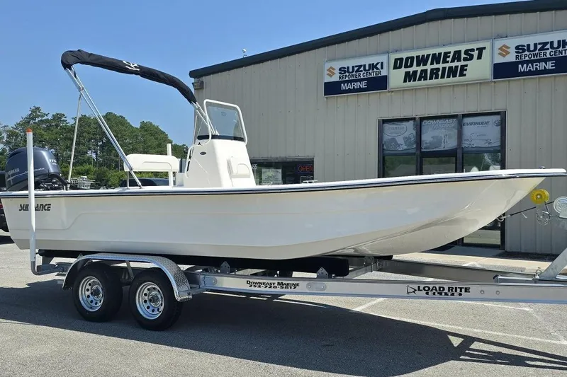 The Image of 2026 Sundance B22CCR boat on trailer at Downeast Marine dealership. - 1