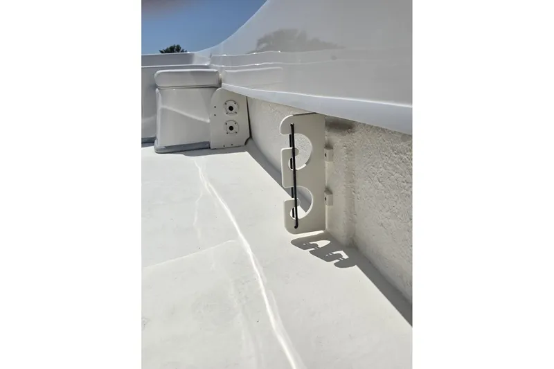 Slide: The Image of White interior detail of 2026 Sundance B22CCR boat, featuring sleek design and fixtures. - 10