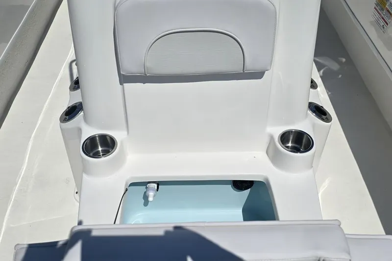 Slide: The Image of Interior of 2026 Sundance B22CCR boat with cup holders and storage compartment. - 9