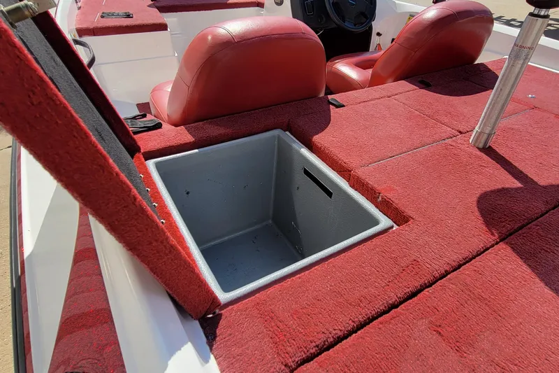 Slide: The Image of Red interior of 2000 Nitro 640LX boat with open storage compartment. - 12