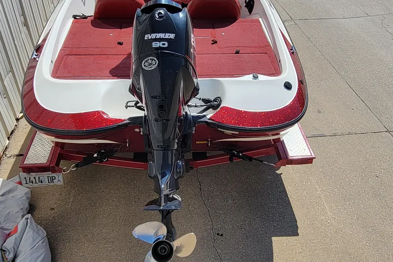 Slide: The Image of 2000 Nitro 640LX boat with Evinrude 90 engine on a trailer. - 16