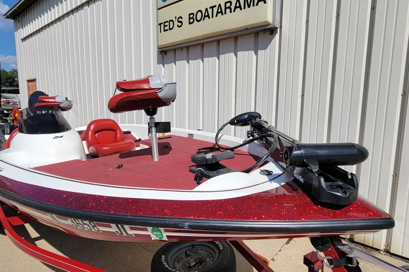 Slide: The Image of 2000 Nitro 640LX boat with red seats and trolling motor at Ted's Boatarama. - 35