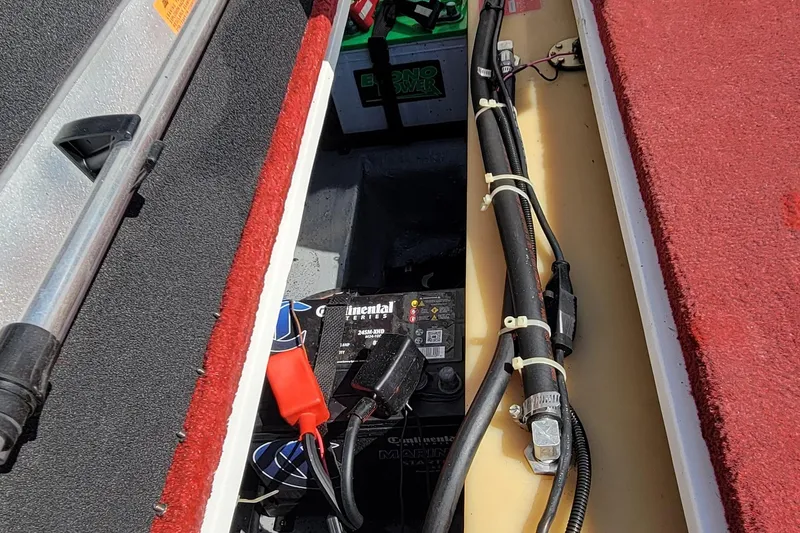 Slide: The Image of Battery compartment of a 2000 Nitro 640LX boat with wiring and components. - 9