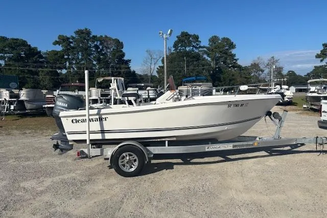 The Image of 2008 Clearwater 180 center console boat on trailer, parked outdoors. - 1