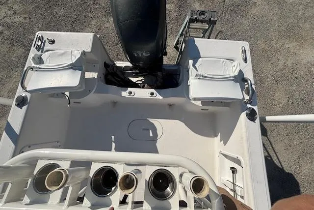 Slide: The Image of 2008 Clearwater 180 Center Console boat interior with engine and seating. - 15